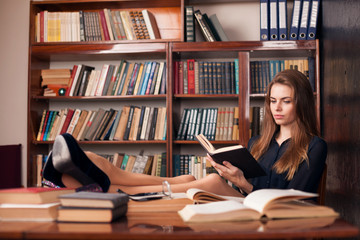 girl is preparing for the exam reads books