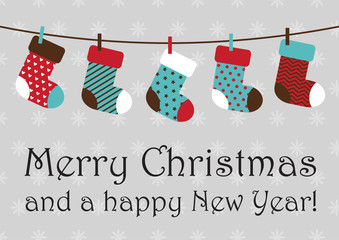 vector illustration of christmas socks hanging on rope