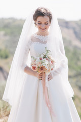 Fototapeta na wymiar Beautiful bride in wedding day outdoors.