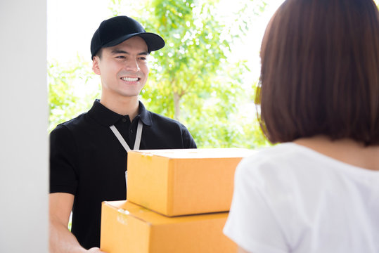 Delivery man deliver packages to a woman