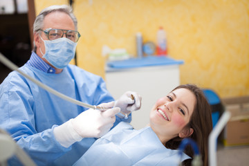 Fototapeta premium Smiling dentist and patient