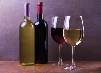 Glasses and bottles of red and white wine. Wine still life. Food and drinks concept