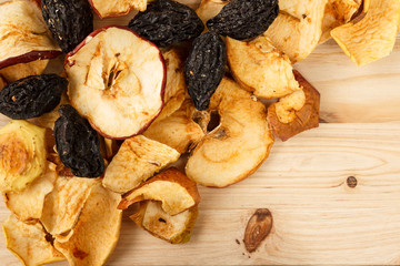 Dried fruits on a wooden background