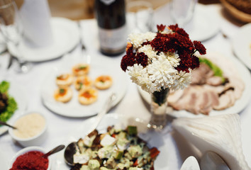 Festive table decorated with colorful bouquets of flowers