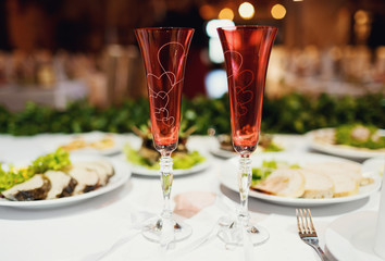 beautiful decorated glasses on the table are for lovers