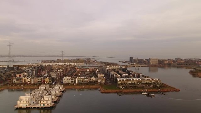 New neighborhood in Amsterdam called IJburg, aerial. Waterfront houses are still under construction.