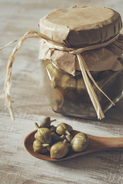 Capers in a wooden  spoon
