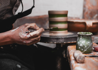 hands working with clay