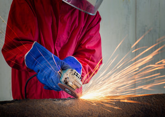 Technician working by grinding