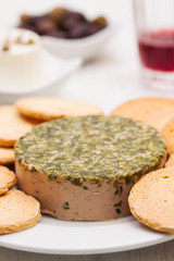Obraz na płótnie Canvas pate with herbs and toasts on white dish