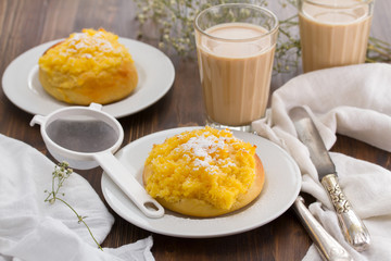 traditional portuguese bread pao de deus and coffee with milk