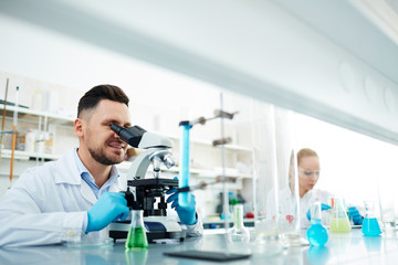 Scientist studying antidote characteristics in laboratory