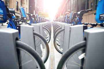 Urban city bikes parked outside at the street