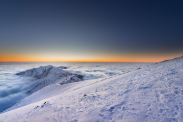 Mountain range above the clouds