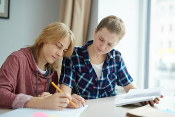 Young designers of clothes carrying out task