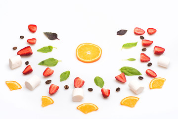 strawberry, marshmallows and orange dessert isolated on white