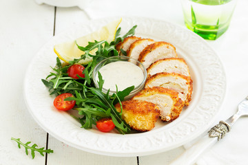 Salad with arugula and chicken breast.