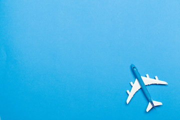 model of passenger plane on blue background