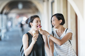 Two young women with ice cream cones