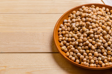 Soybeans over wooden table background