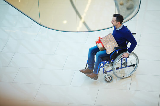 Man in wheelchair shopping alone