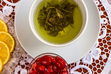 Blown ball in a cup of green tea.