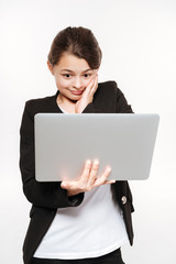 Gorgeous young girl standing with laptop