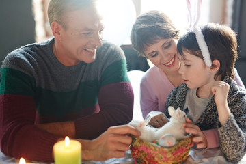 Affectionate family having talk on Easter day