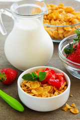 Honey cereals with strawberries for breakfast.