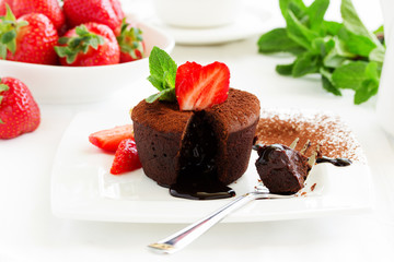 chocolate pudding with fudge center with strawberries,