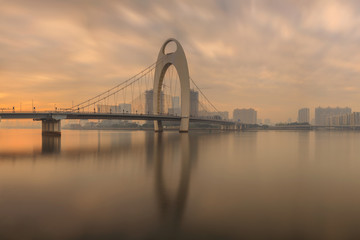Modern bridge in Zhujiang River and modern building of financial district in Guangzhou, China