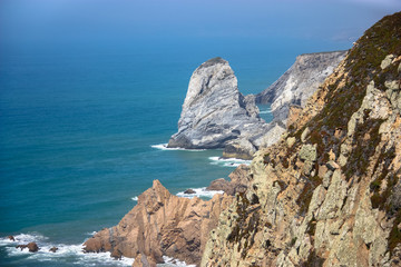 Fototapeta na wymiar Rocky shore of the Atlantic Ocean coast of Cabo da Roca, Portugal