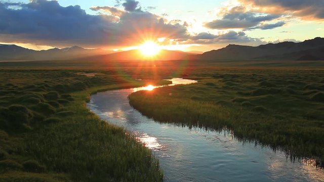 Sunset over mountain river. Mongolia