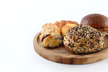 Bread with sesame on a wooden tray White background
