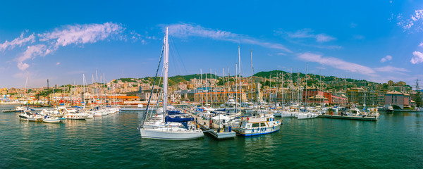 Naklejka na ściany i meble Panorama of marina Porto Antico Genova, where many sailboats and yachts are moored, Genoa, Italy.