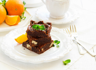 Fototapeta na wymiar Delicious chocolate brownie with caramel and orange.