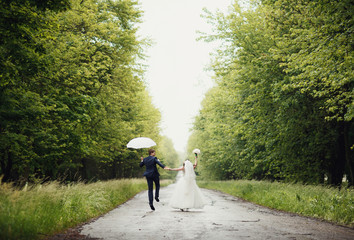 Happy couple in the rain