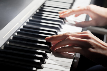 Obraz premium Playing Piano. close up