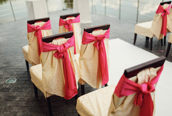 big pink bows on chairs