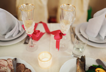glasses newlyweds tied pink ribbon