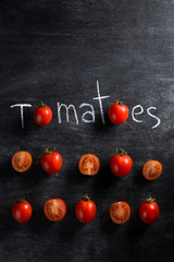 Picture of cut tomatoes over dark background