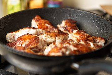 Fried Chicken Cooking in an pan closeup