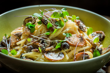 Closeup of fresh spaghetti with mushrooms and parsley