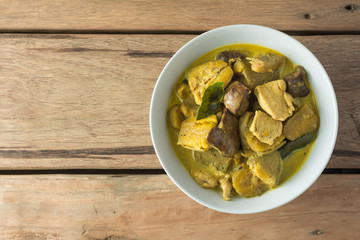 Chicken Curry with Eggplant on wooden table.