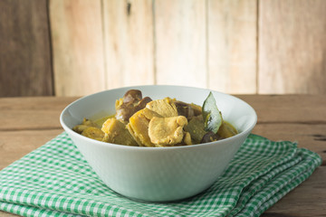Chicken Curry with Eggplant on wooden table.