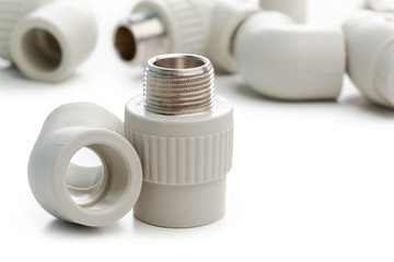 Set of metal-plastic plumbing couplings, adapters, plugs isolated on white background