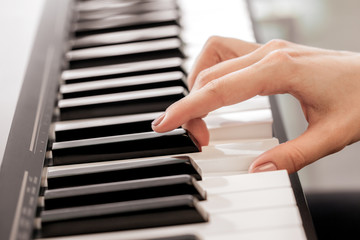 Fototapeta premium Closeup of hands playing piano. Music and hobby concept