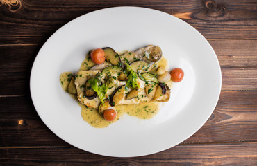 fish fillet with courgettes and tomatoes