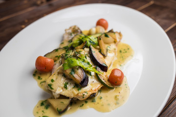 fish fillet with courgettes and tomatoes