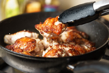 Fried Chicken Cooking in an pan closeup